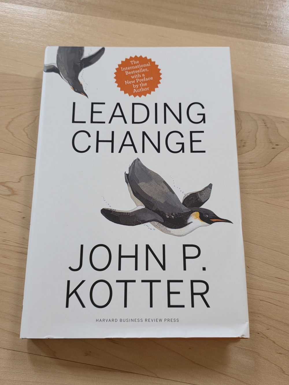 Leading Change by John P. Kotter - White Cover with Penguin Illustration